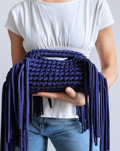 Close-up of bold crochet texture and fringe detail on Chezsue clutch bag