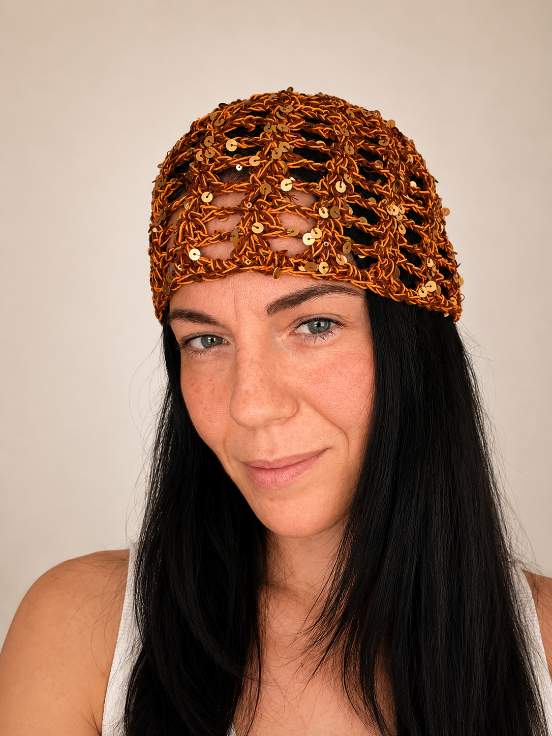 Handmade crochet mesh hat in olive green metallic yarn, front view worn by model, lightweight summer headwear handmade in Australia.