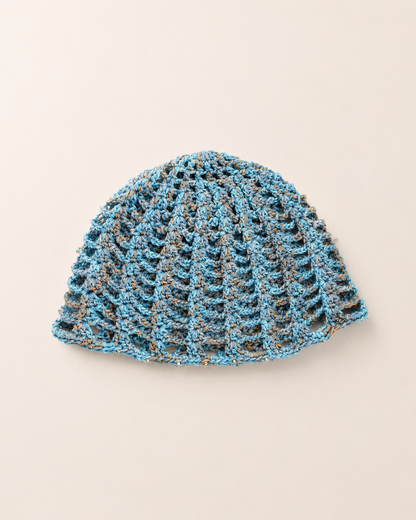 The Capri Hat in olive green, handmade crochet mesh hat crafted from metallic blend yarn, lightweight summer accessory.
