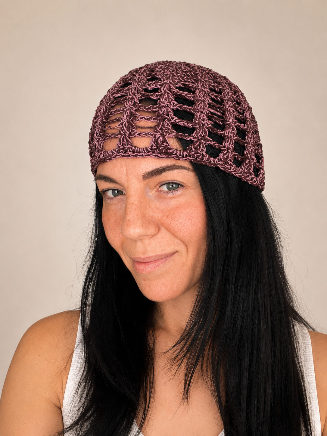 Handmade crochet mesh hat in olive green metallic yarn, front view worn by model, lightweight summer headwear handmade in Australia.