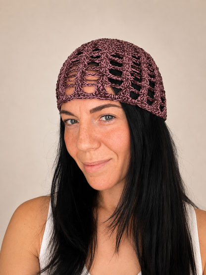 Handmade crochet mesh hat in olive green metallic yarn, front view worn by model, lightweight summer headwear handmade in Australia.