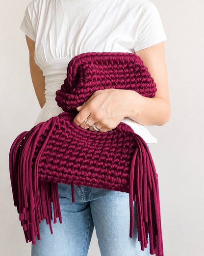 Handmade crochet clutch bag with signature side fringe detail