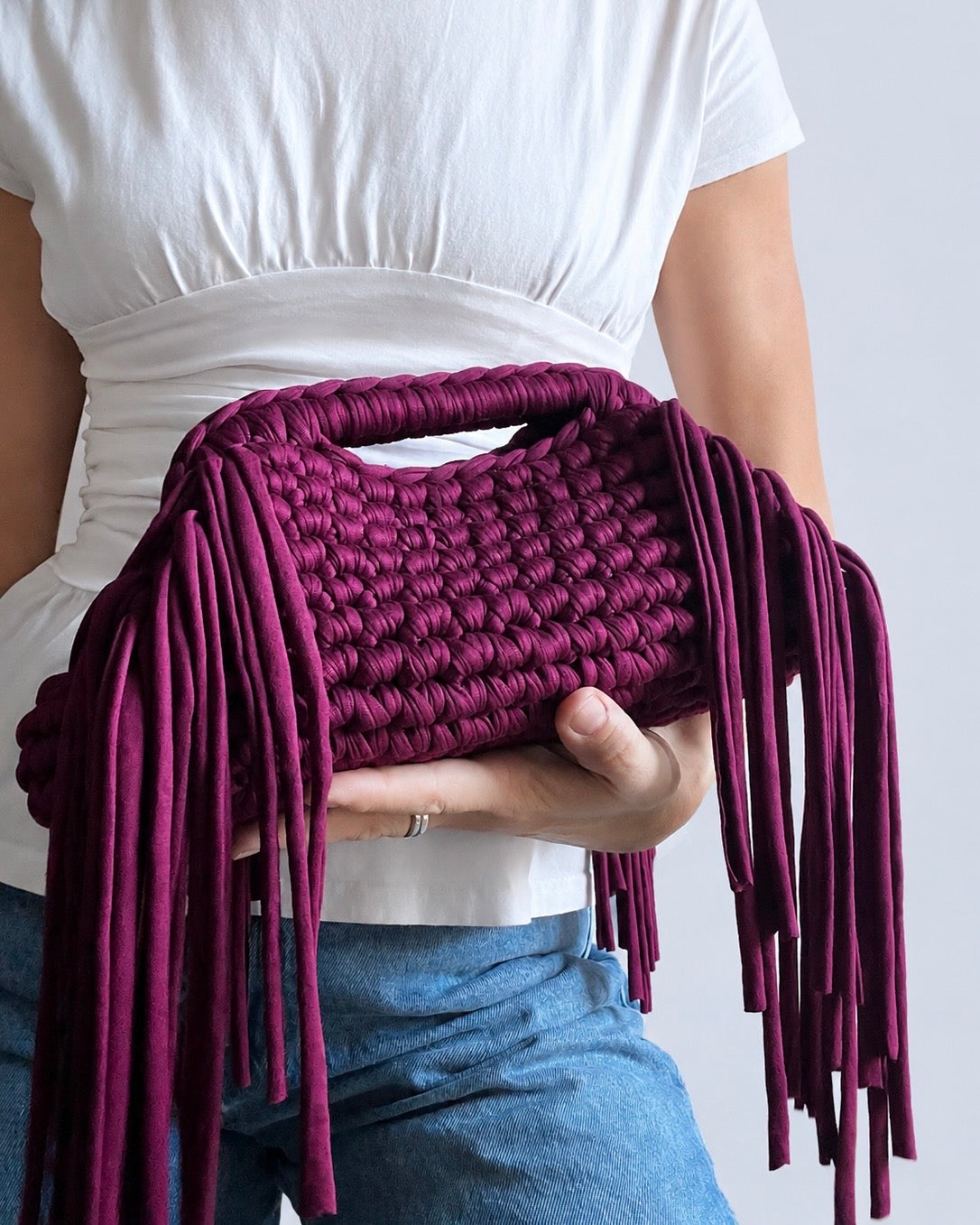 Statement handmade fringe clutch bag styled by hand