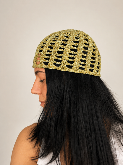Side view of The Capri Hat, handmade crochet mesh hat in olive green metallic yarn, breathable summer accessory handcrafted in Australia.