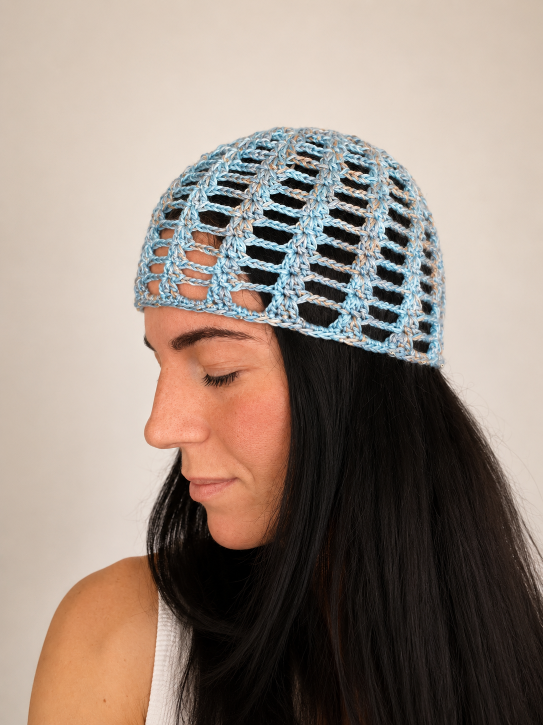 Side view of The Capri Hat, handmade crochet mesh hat in olive green metallic yarn, breathable summer accessory handcrafted in Australia.